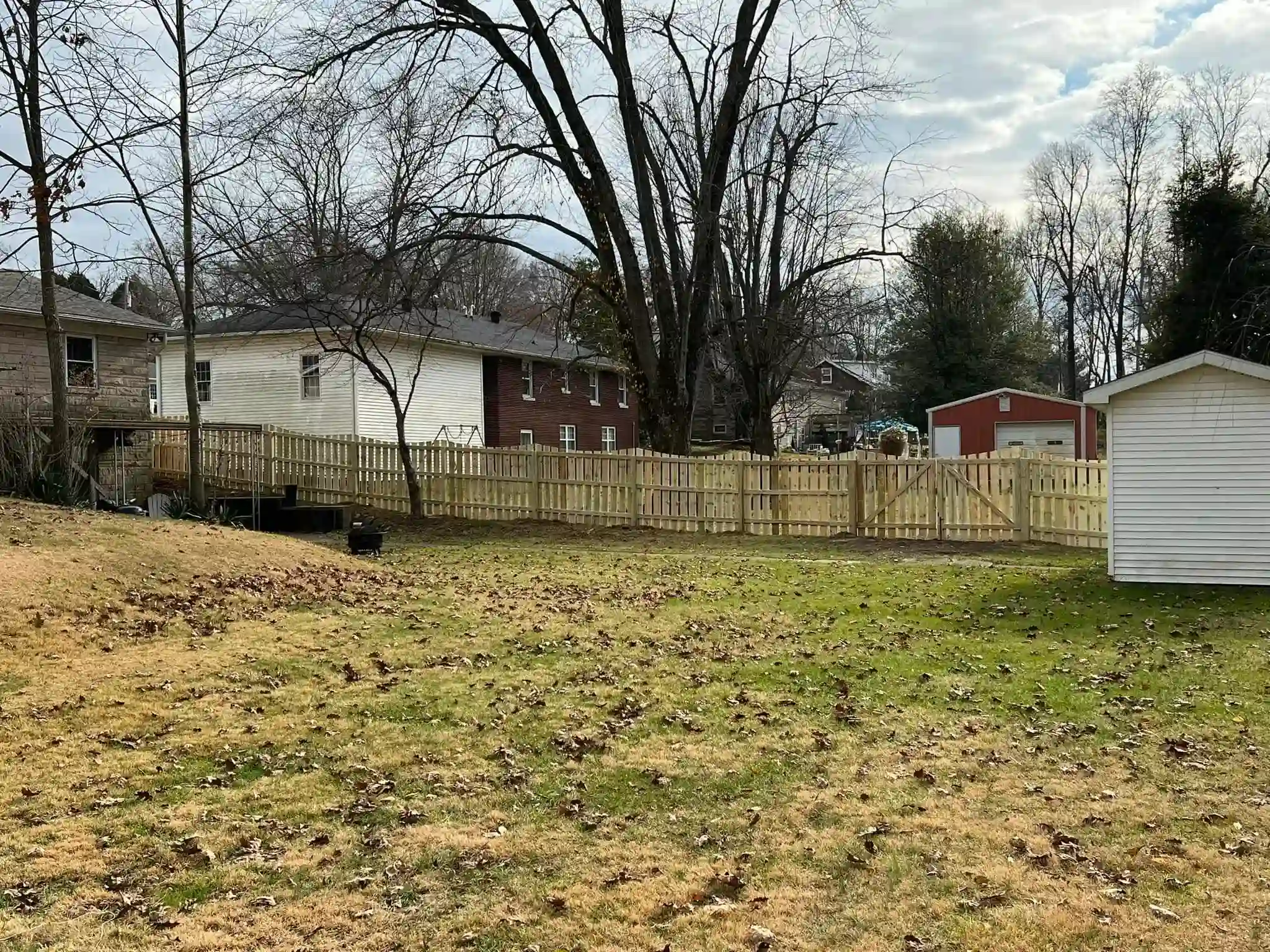 wooden picket fence with scallop finish